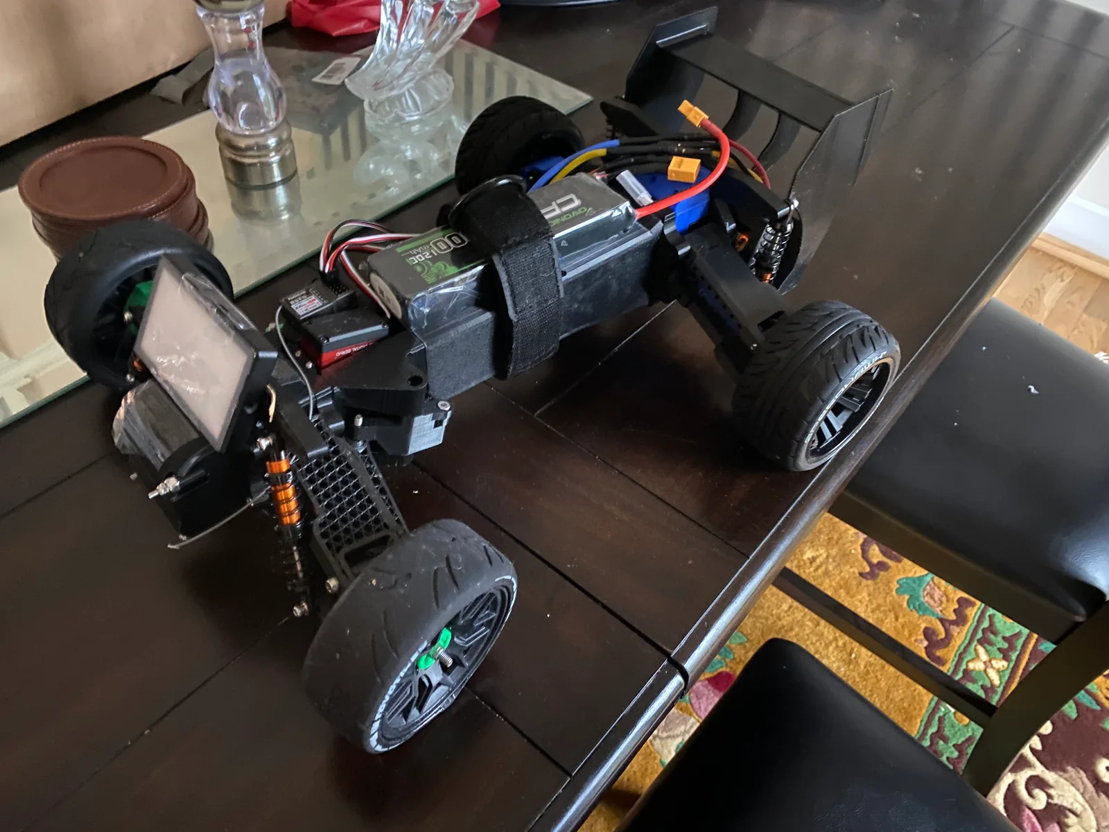 The assembled RC car on a workbench.